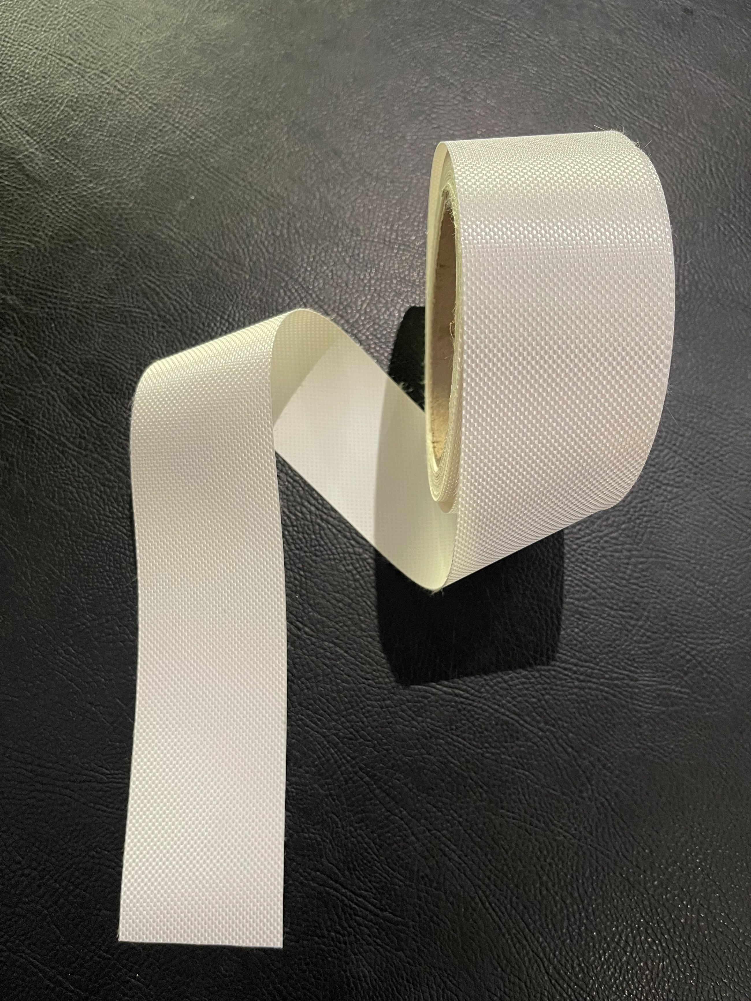 Close-up of the 50mm weld-tape used to hem the mesh